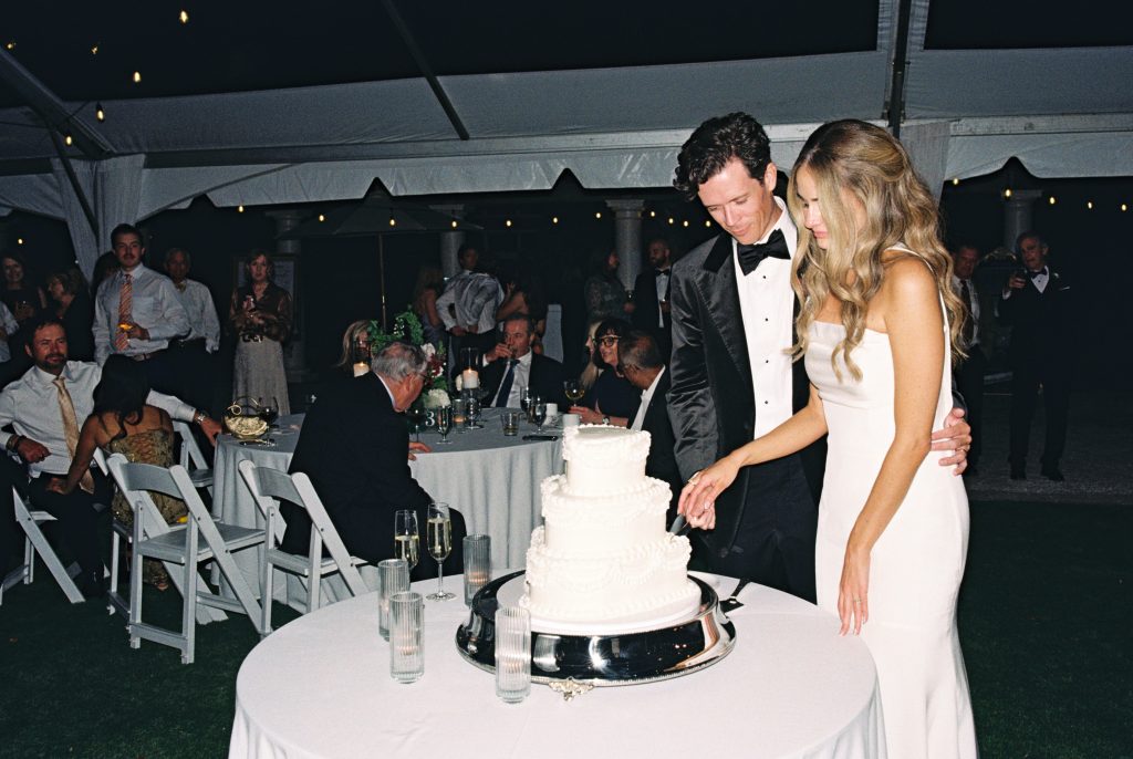 bride and groom cake cutting shot on 35mm film
