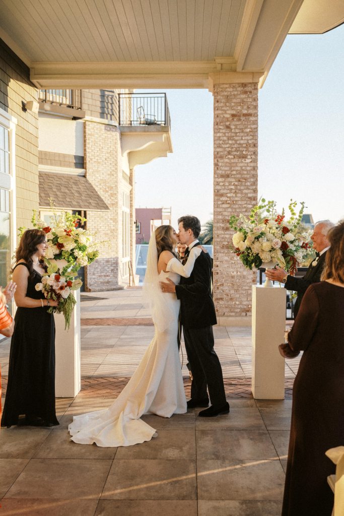 bride and groom first kiss