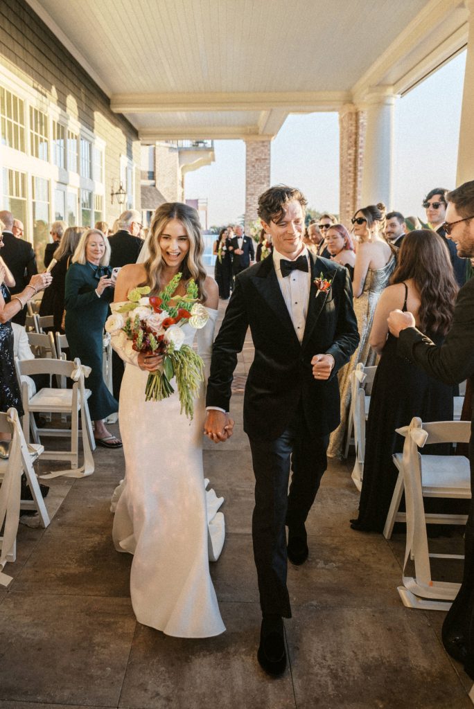bride and groom celebrate going down the isle