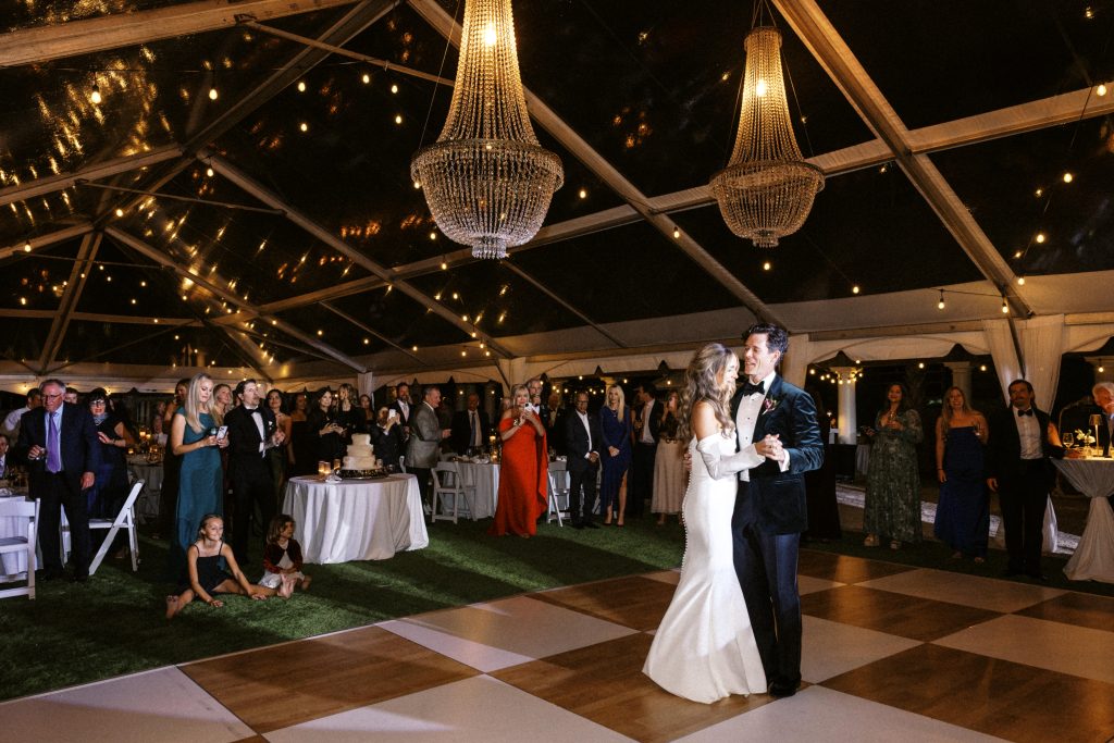 bride and groom's first dance during a tented luxury reception